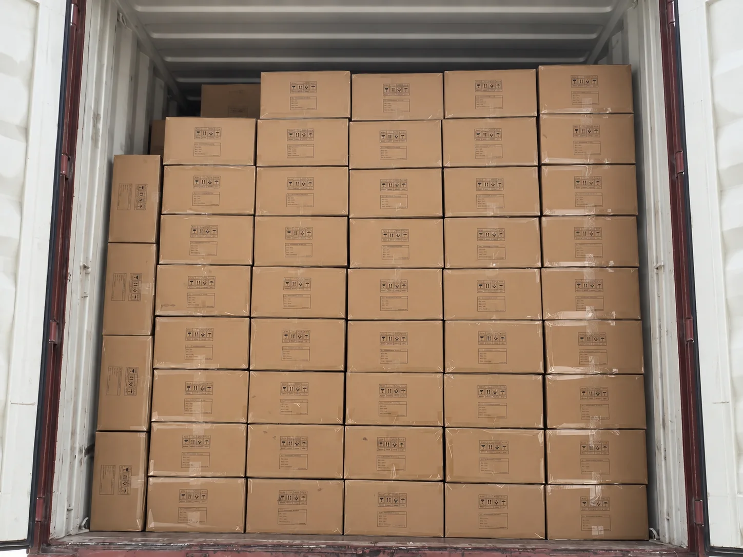 Finished bag orders packed in cartons for export loading